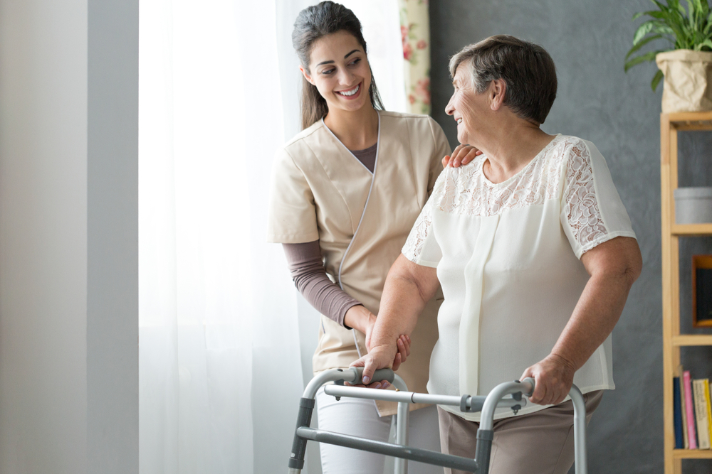 Lady being helped by a nurse